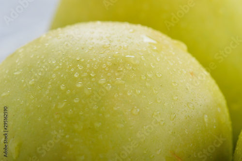 Apples closeup. Texture of apples, water droplets.