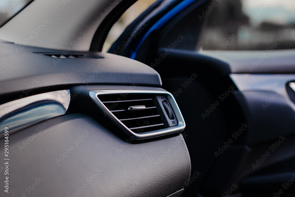 Air conditioner system in modern car, closeup. Air duct grille of modern car. Air conditioner system in modern car, closeup. Air duct grille of modern car.