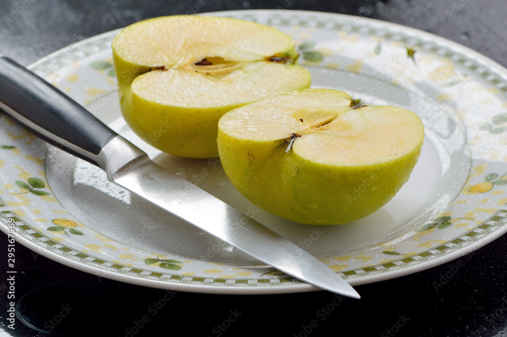 Green fresh apples on the table, cut. Green fresh apples on the table, cut.