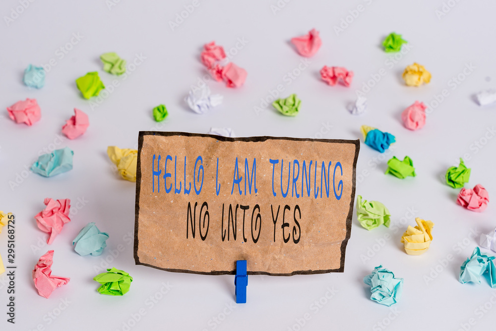 Text sign showing Hello I Am Turning No Into Yes. Business photo text Persuasive Changing negative into positive Colored crumpled papers empty reminder white floor background clothespin