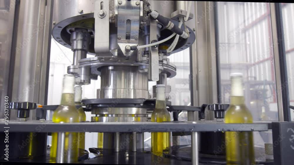 Beer factory process with glass bottles and automated machinery Beer factory process with glass bottles and automated machinery