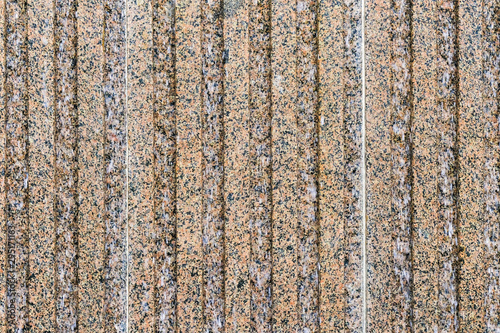 Artificial granite wall background and texture, close-up.