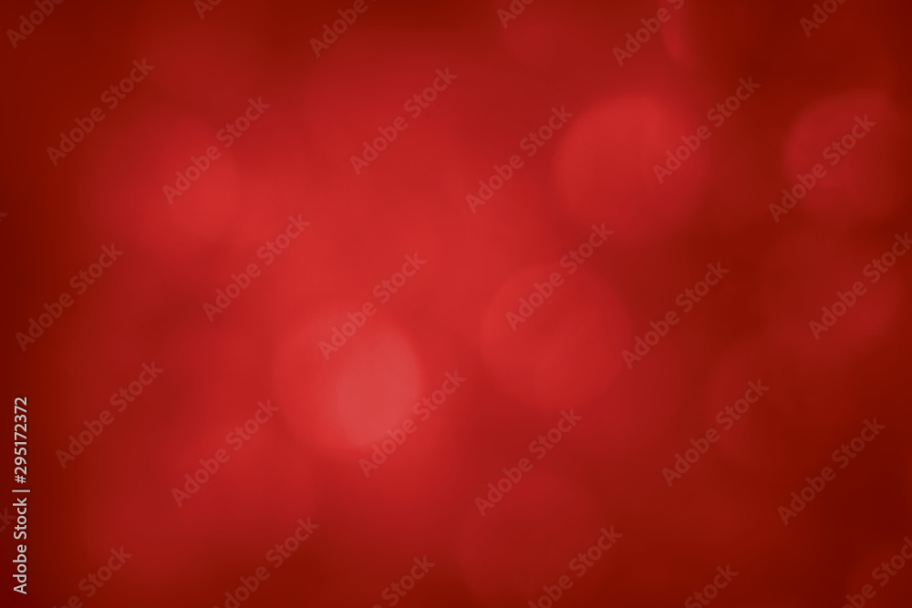 Red bokeh lights. Blur circles lens flare. Illuminated glow. Festive abstract background.