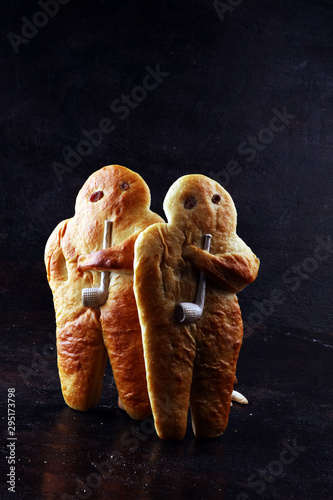 stutenkerl or weckmann. baked traditional german pastery on rustic background photo