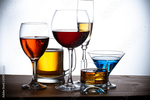 assortment of alcoholic beverages and glasses