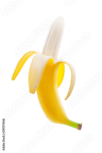Half peeled ripe juicy yellow single banana isolated on white background