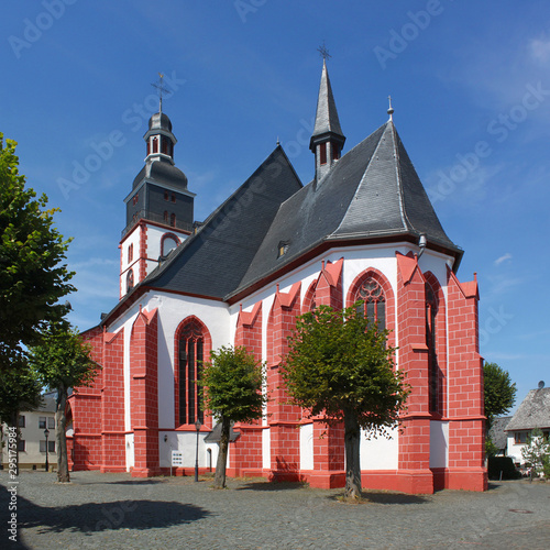 The red colored apse of the old gothic city church in Kirchberg town, Germany photo