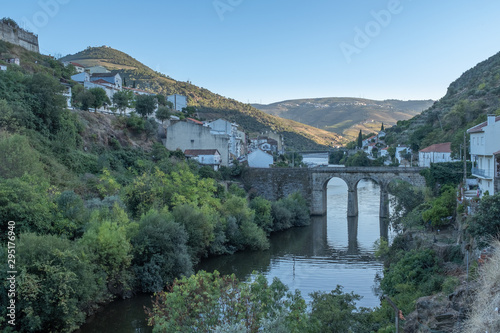 The town of Pinhão in the Douro Valley with a stone bridge crossing the River Douro at dusk