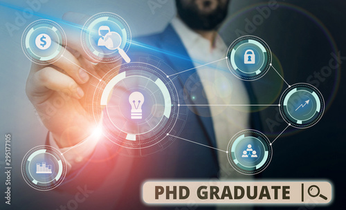 Word writing text Phd Graduate. Business photo showcasing highest university degree that is conferred after a course Male human wear formal work suit presenting presentation using smart device