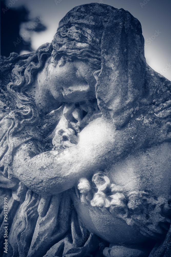 Ancient statue of woman on tomb as a symbol of depression pain and sorrow (faith, religion, Christianity, death concept) Ancient statue of woman on tomb as a symbol of depression pain and sorrow (faith, religion, Christianity, death concept)