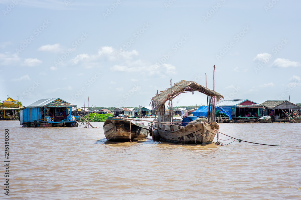 Siem Reap / Cambodia - May 26 / 2019 : boats tied in front of floating village Siem Reap / Cambodia - May 26 / 2019 : boats tied in front of floating village