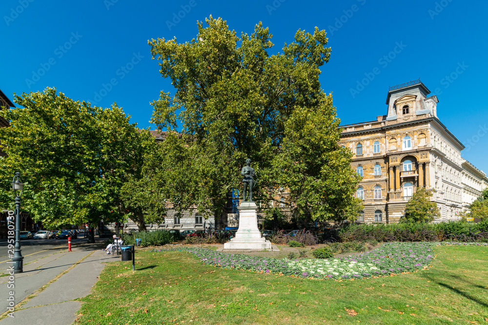 Budapest, Hungary - October 01, 2019: Andrassy Avenue (Hungarian: Andrássy út) is a boulevard in Budapest, Hungary, dating back to 1872. The statue of Balassi Balint in park.