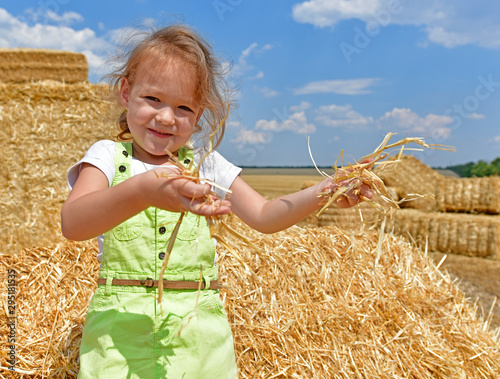 Photoshoot of a child in the hayloft, village Maryanovka Ukraine. photo