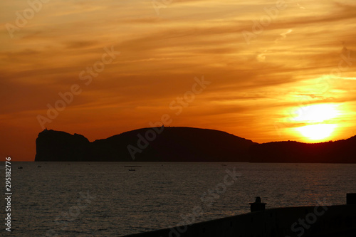 Sunset in Alghero, Sardinia, Italy. Capo Cassia in the background. © Afonso Farias