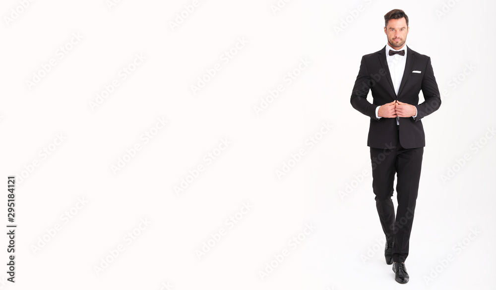 Handsome man in classic black suit looks very elegant. Handsome man in classic black suit looks very elegant.