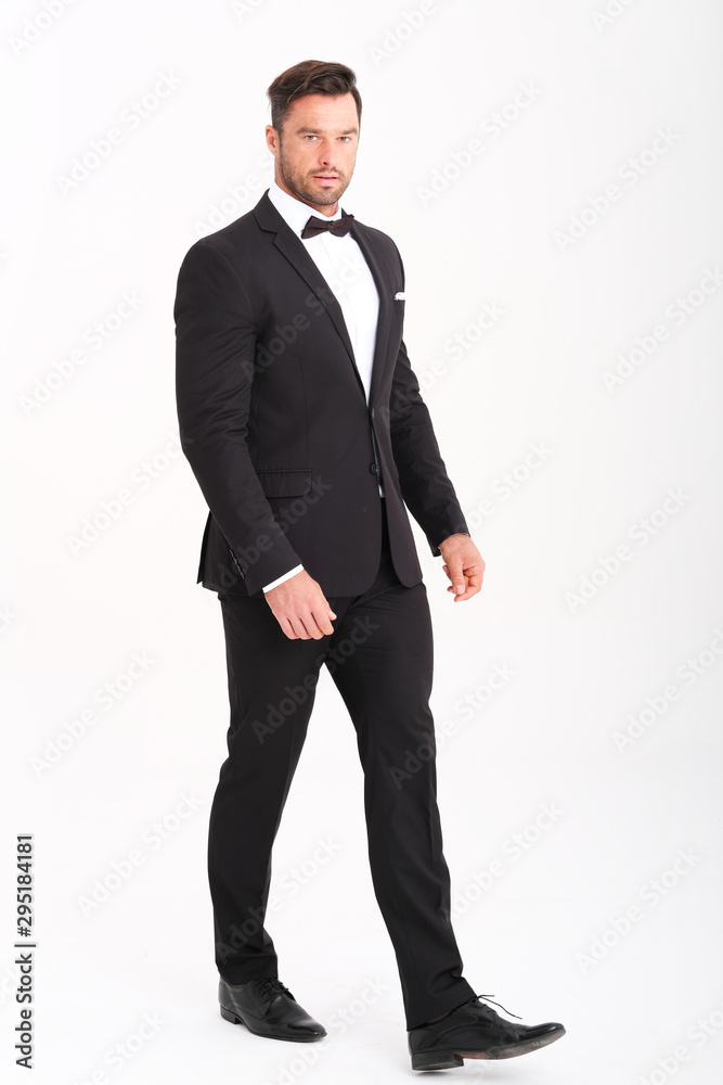 Handsome man in classic black suit looks very elegant. Handsome man in classic black suit looks very elegant.