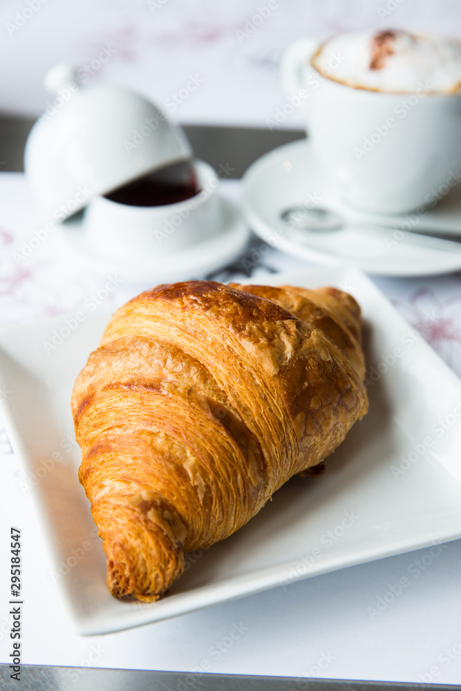 Croissant, in a breakfast setting.