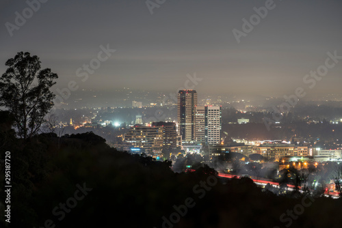 Fotografie, Obraz Foggy morning twilight view of the Burbank media district in the San Fernando Valley area of Los Angeles, California