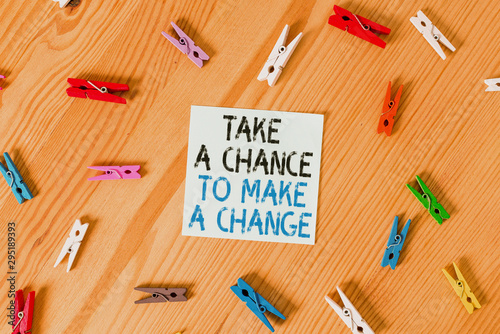 Writing note showing Take A Chance To Make A Change. Business concept for dont lose opportunity to reach bigger things Colored clothespin papers empty reminder wooden floor background office