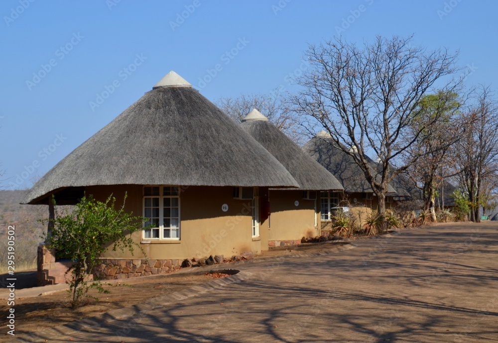 Row of thatch roof rondawel huts at the Olifants Rest Camp in Kruger National Park game reserve in South Africa Row of thatch roof rondawel huts at the Olifants Rest Camp in Kruger National Park game reserve in South Africa