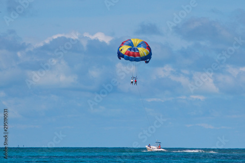 Parasailing in clear blue water in Belize