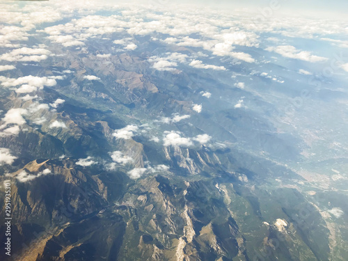 Aerophotography of swiss alps with clouds. High altitude photography. 