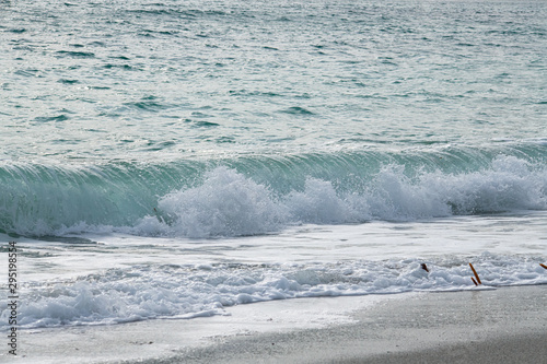 Beautiful turquoise rolling surf onto a Cornish beach
