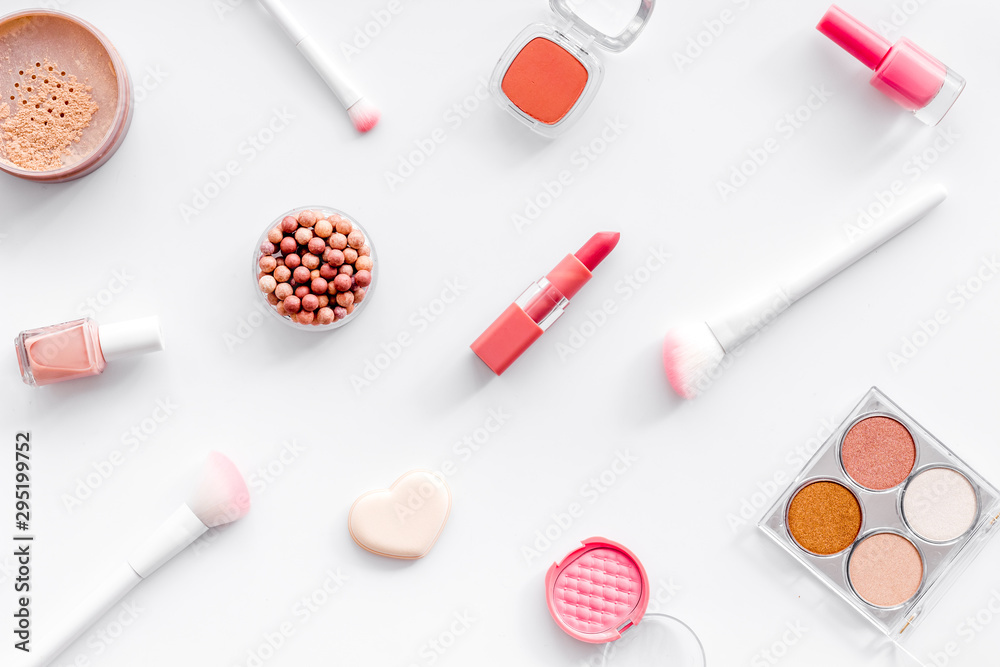 Makeup set with powder, rouge and brusheson white background top view pattern Makeup set with powder, rouge and brusheson white background top view pattern