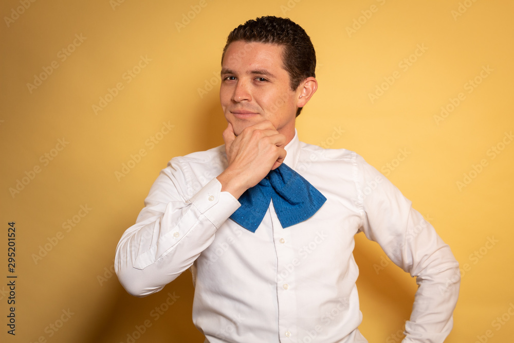Retrato Hombre Mexicano charro Joven pensando moño azul Stock Photo | Adobe  Stock