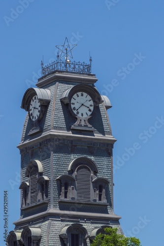 Historic Clock Tower of the Hood County Courthouse in Granbury, Texas photo