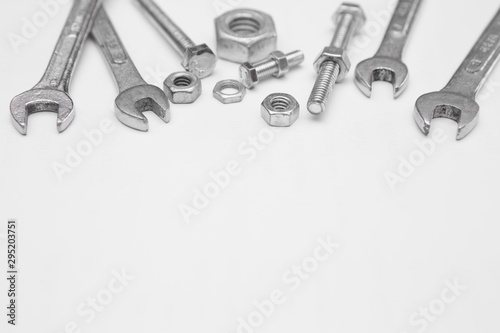 Many wrench with nuts and bolts on  white background