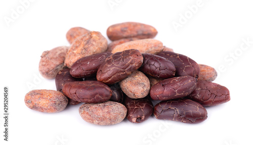 Unpeeled and peeled cacao beans, isolated on white background. Roasted and aromatic cocoa beans, natural chocolate.