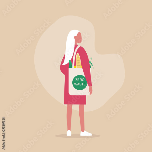 Zero waste concept, young female millennial character carrying groceries in a reusable eco friendly shopper bag
