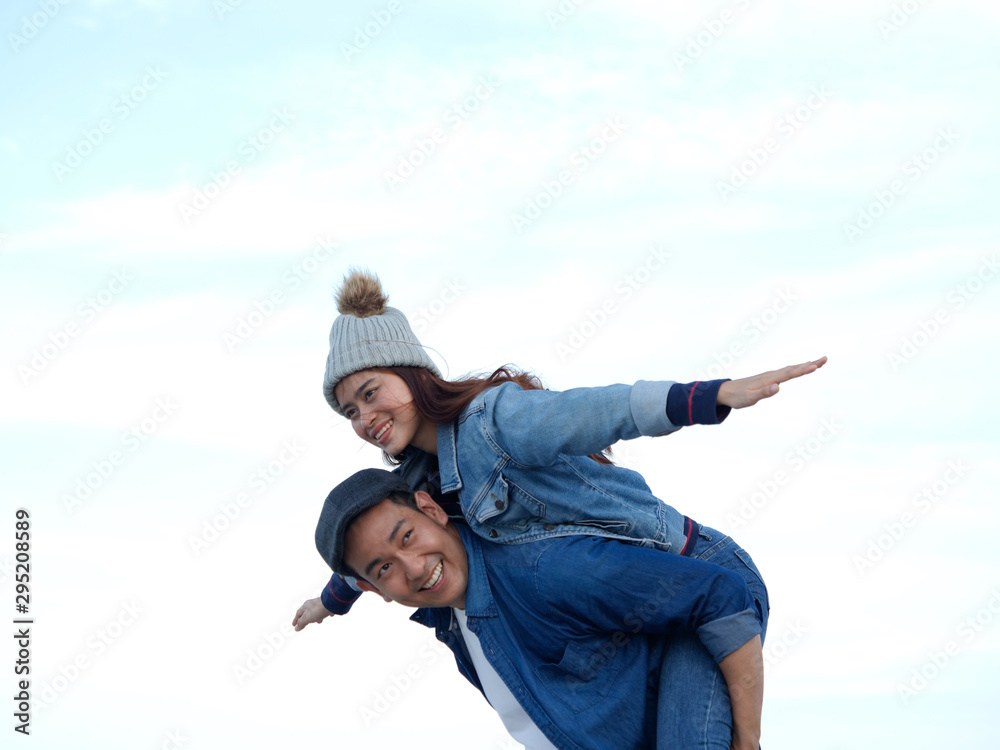 Young Asian couple in blue shirt enjoy together happy and smile romantic time together Young Asian couple in blue shirt enjoy together happy and smile romantic time together