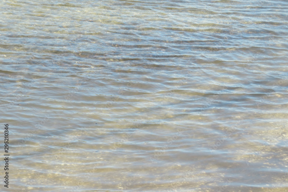 Light blue rippled water surface on Florida river, natural water background