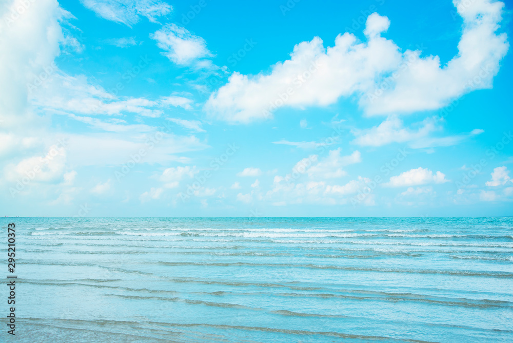Fototapeta premium Beautiful beach, sea water, clear sky at morning with gentle wind waves. Concept for a nice holiday vacation.