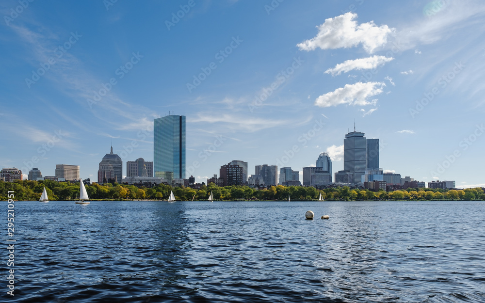 City skyline under clear sky with river in front City skyline under clear sky with river in front
