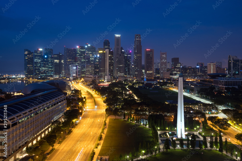 Panorama of Singapore business district skyline and skyscraper with War Memorial Park in night at Marina Bay, Singapore. Asia,