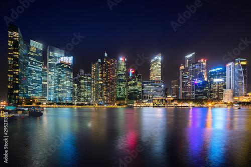 Singapore business district skyline financial downtown building with tourist sightseeing in night at Marina Bay  Singapore. Asian tourism  modern city life  or business finance and economy concept