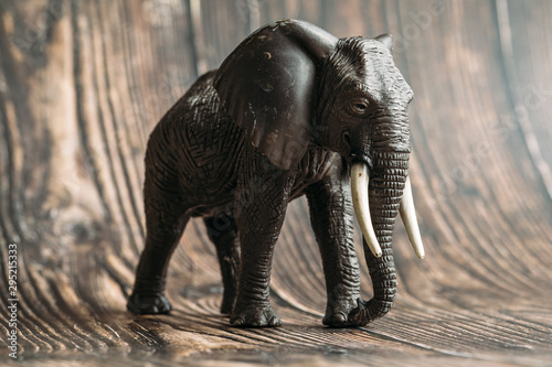 figure of a toy elephant on a wooden background