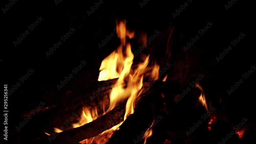 Orange flames on black background, close up of fireplace Orange flames on black background, close up of fireplace