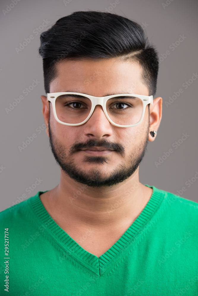 Face of young handsome Indian man wearing eyeglasses Face of young handsome Indian man wearing eyeglasses