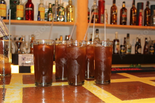 Glasses with cold drinks served in a bar