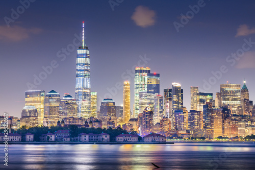 New York, New York, USA skyline from the harbor with Ellis Island