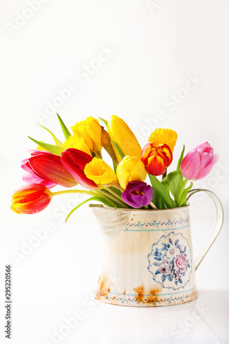 Bouquet of tulips in a vase. Selective focus.  Copy space