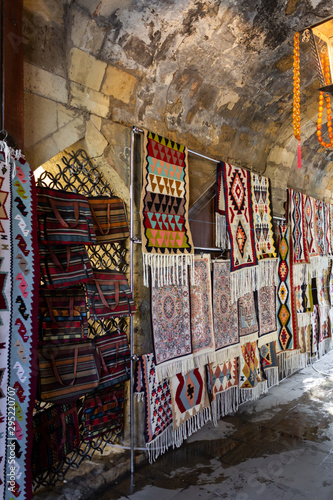 Street bazaar of ancient oriental handmade Garabagh, Tabriz, Shirvan style carpets, rugs at Old Town Baku, Azerbaijan © Gozalov