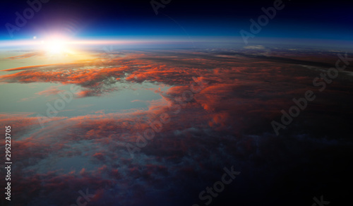 Earth with sunrise on blue space background © Sergey Nivens