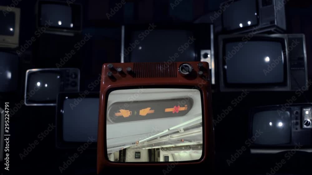 No Smoking and Fasten Seat Belt Sign in the airplane on a Retro TV that Explodes and Breaks. Blue Dark Tone. No Smoking and Fasten Seat Belt Sign in the airplane on a Retro TV that Explodes and Breaks. Blue Dark Tone.