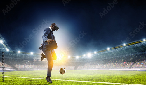 Black businessman on virtual reality football match © Sergey Nivens