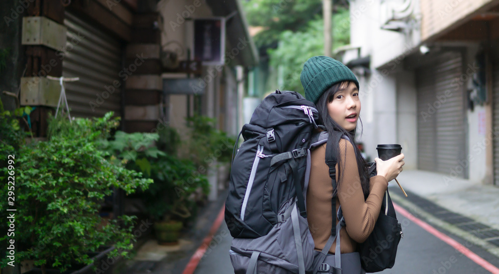 backpack girl walk in the country side with coffee in the morning backpack girl walk in the country side with coffee in the morning